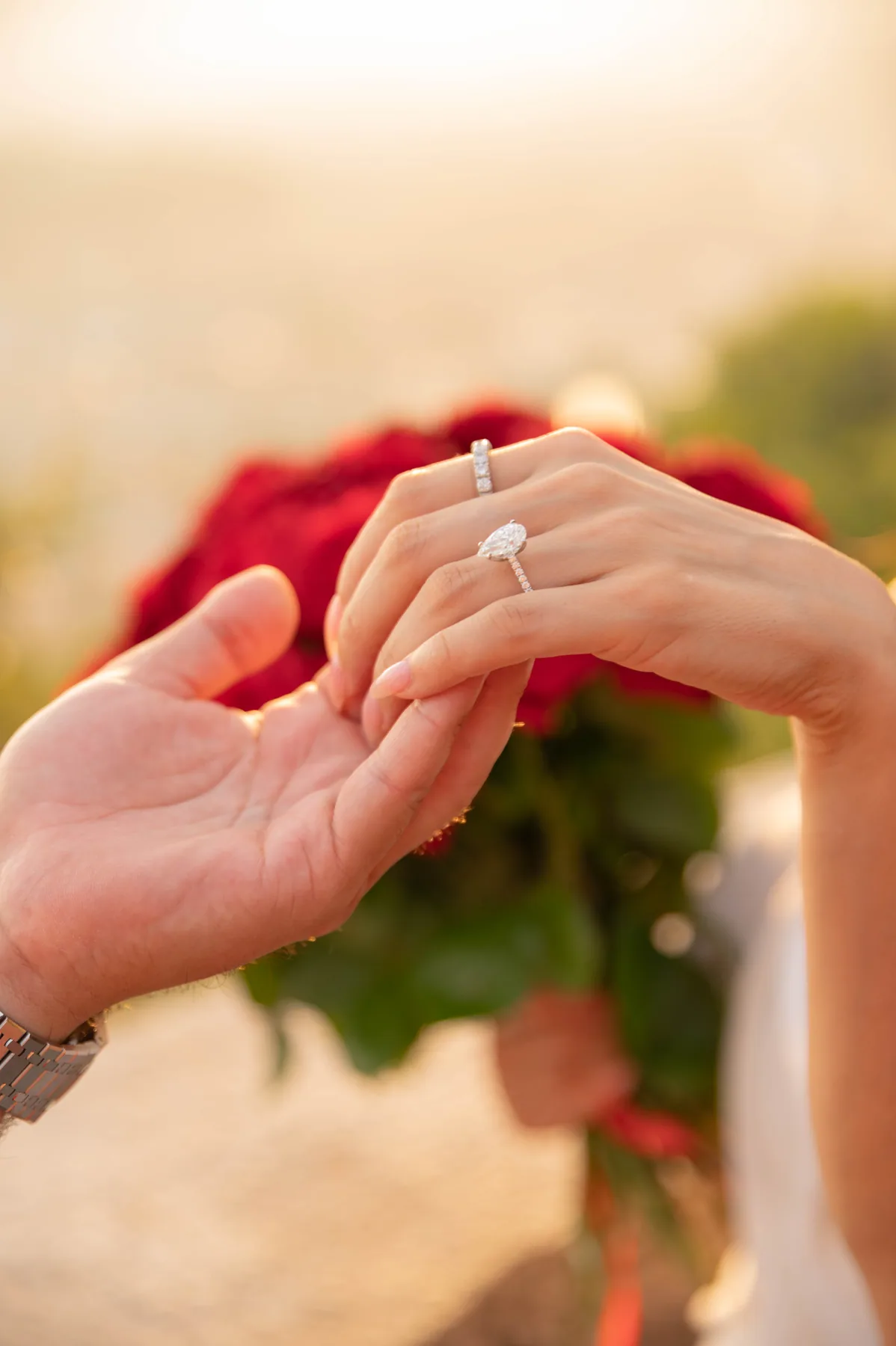 The ring going on, against the light