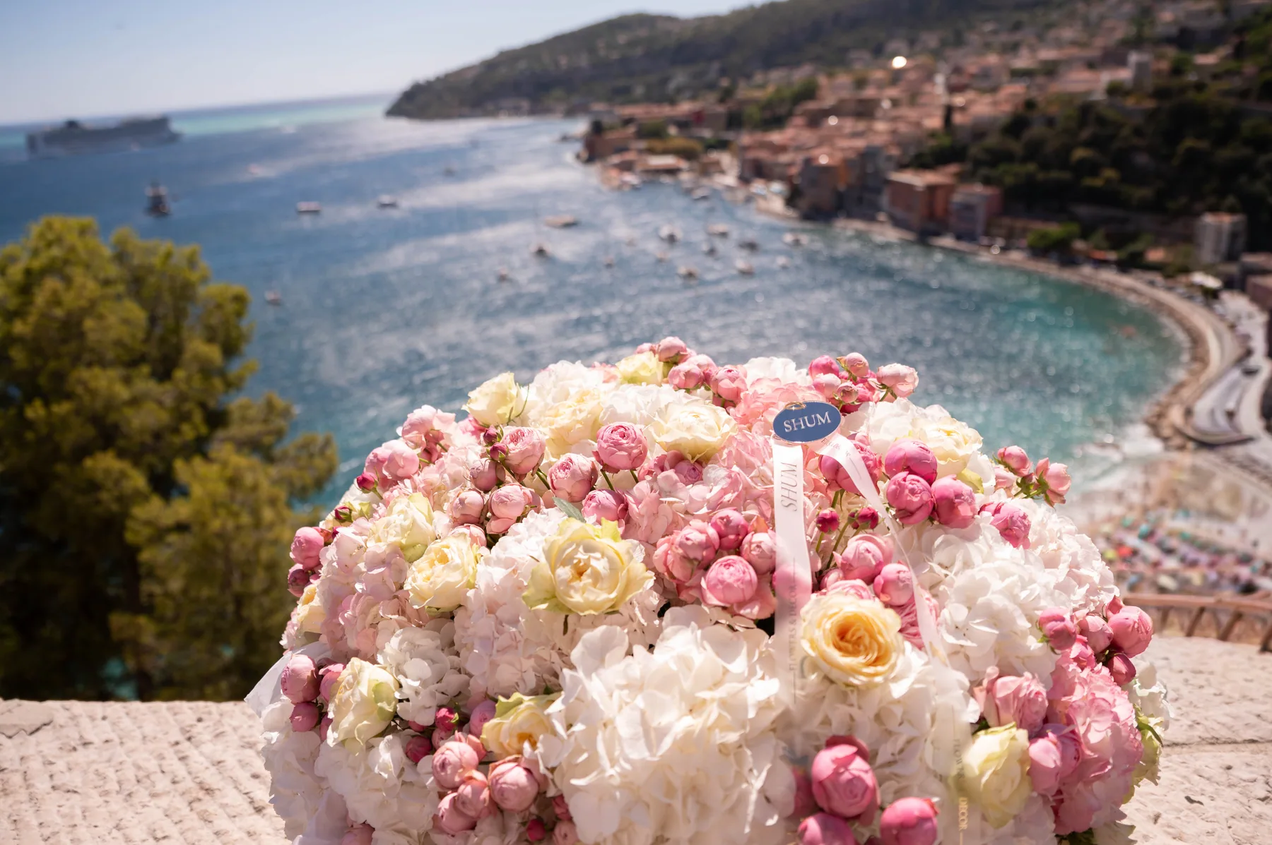 A floral arrangement on a terrace above the sea
